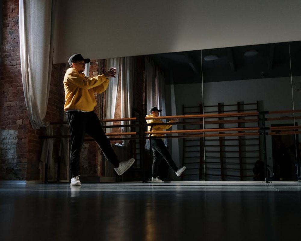 Man focusing on his movement in a minimalist studio